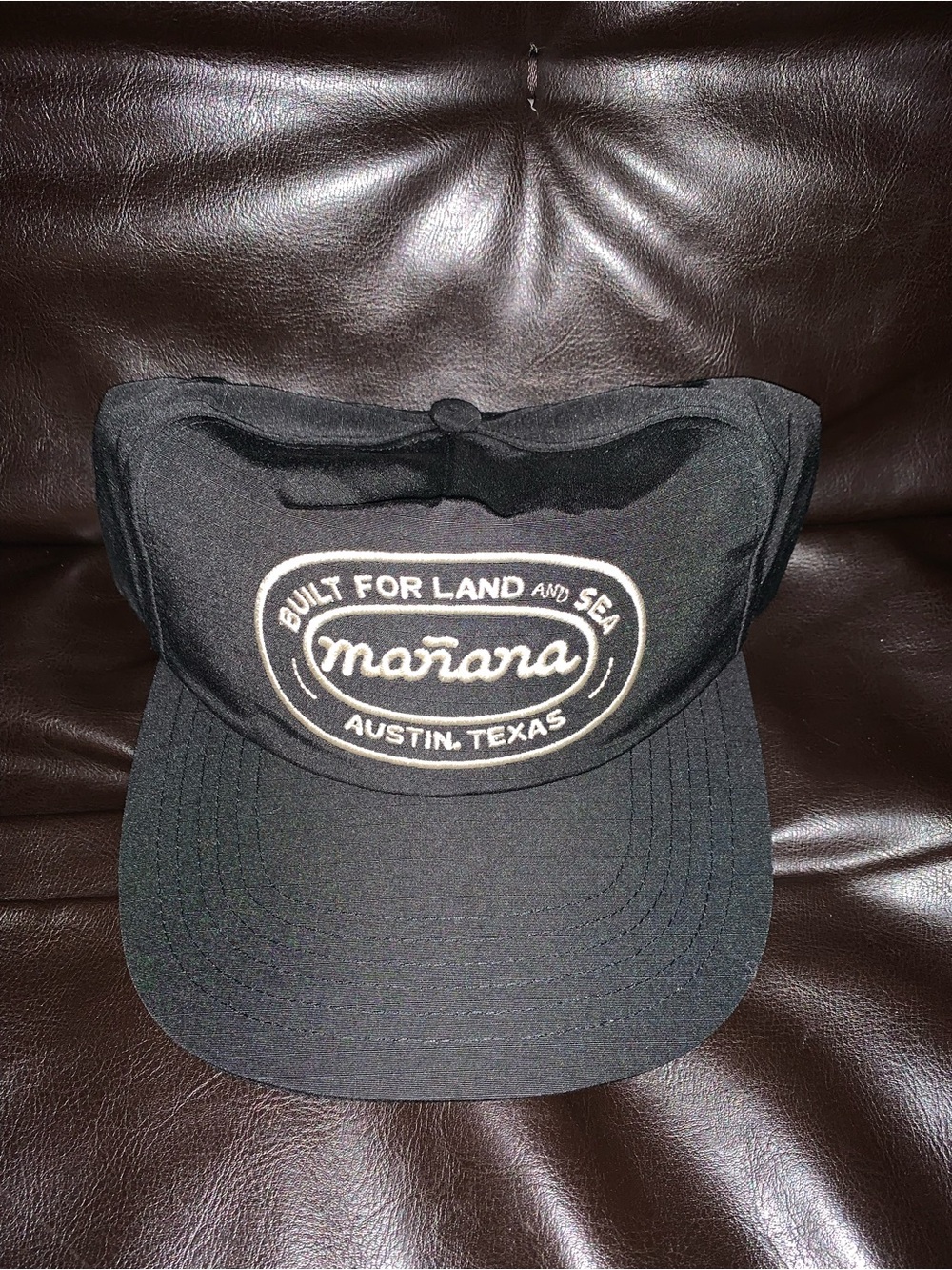 Manana Surf Co. Black Trucker Hat with White Embroidered Logo
